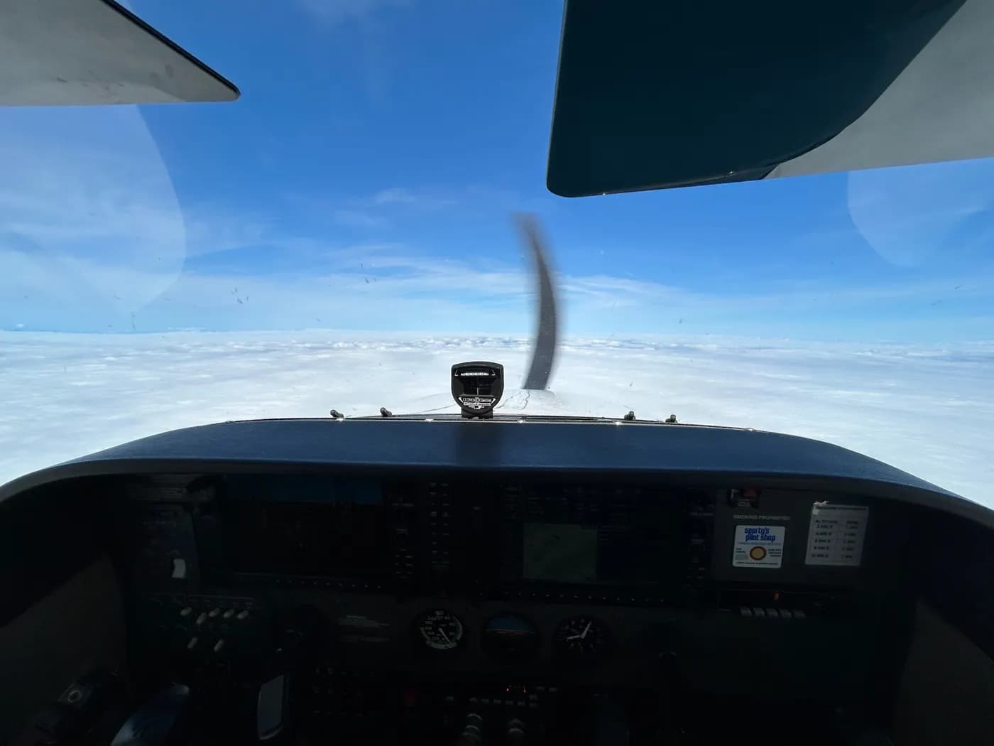 Cockpit view above a cloud layer